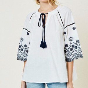 blue and white floral embroidered top